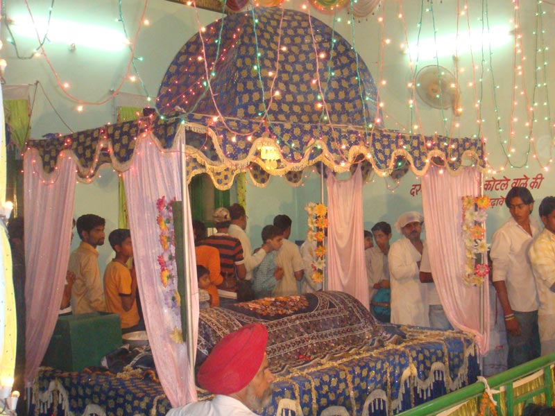 Devotees circumambulating the decorated grave of Haider Shaikh at Peerkhana Shrine in Abohar 2011 -- Yogesh Snehi